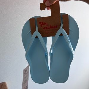 blue archie flip flops never worn